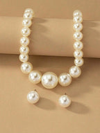 Exaggerated and trendy faux pearl earrings and faux pearl necklace