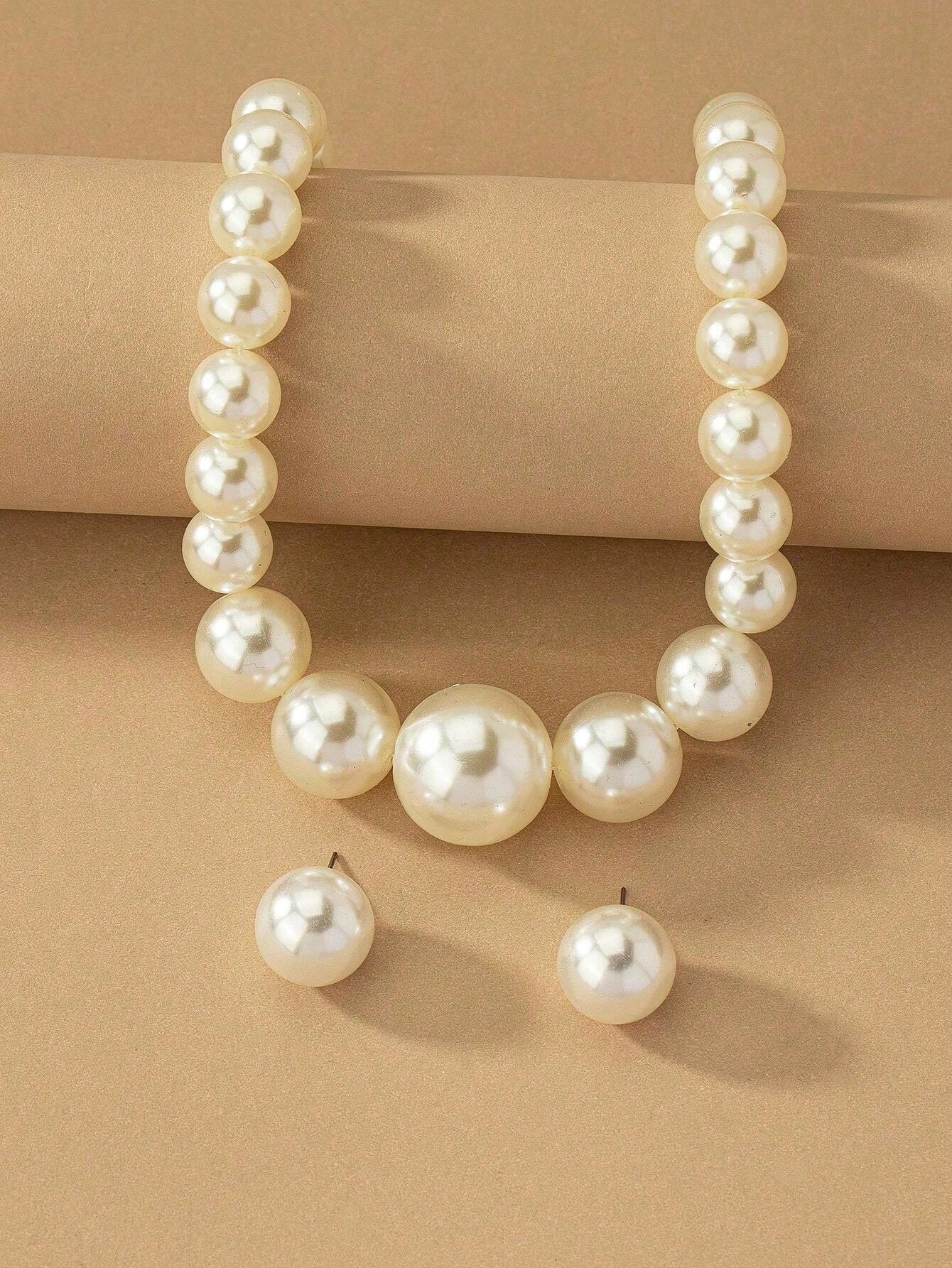 Exaggerated and trendy faux pearl earrings and faux pearl necklace