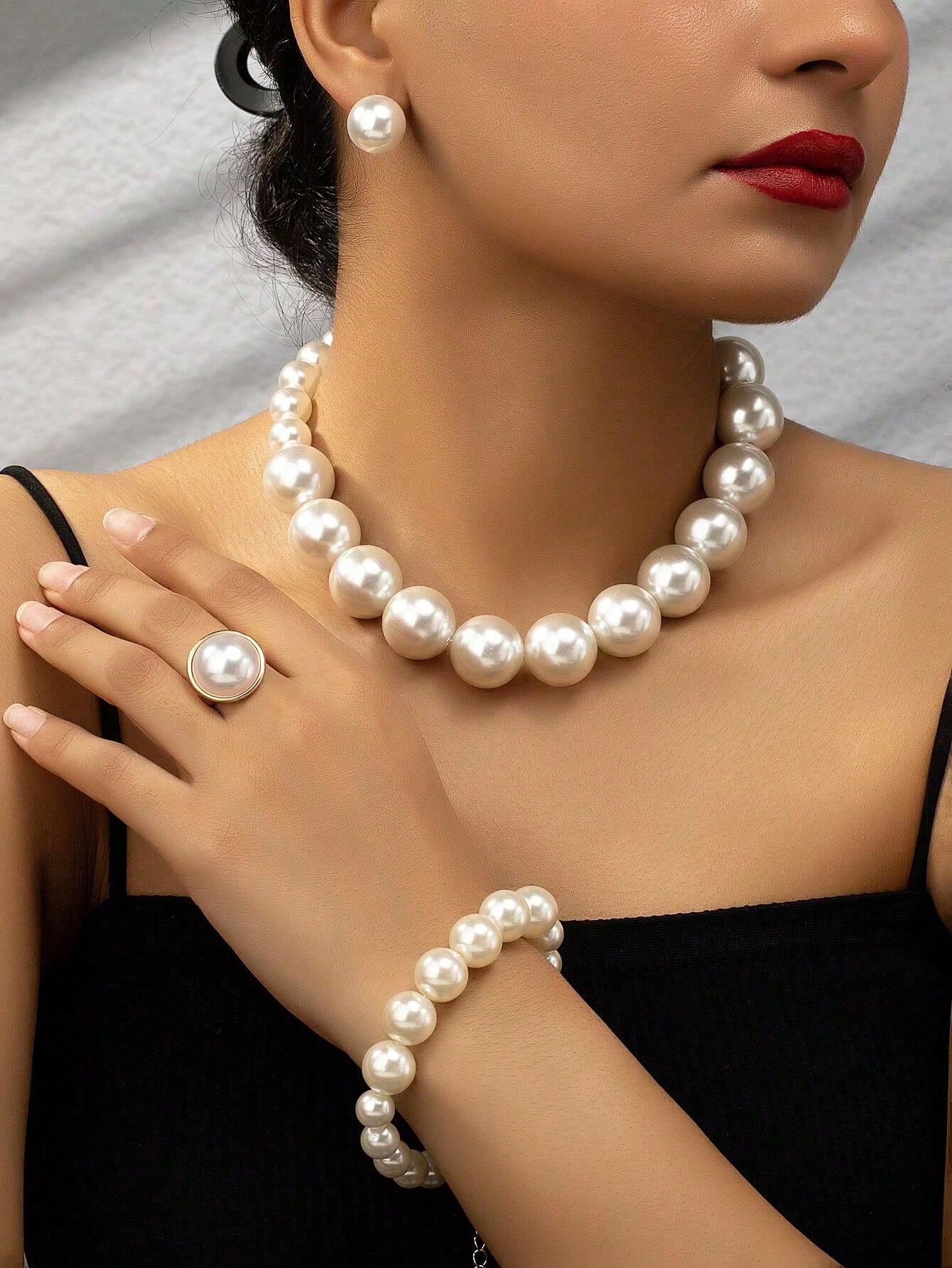 Exaggerated and trendy faux pearl earrings and faux pearl necklace