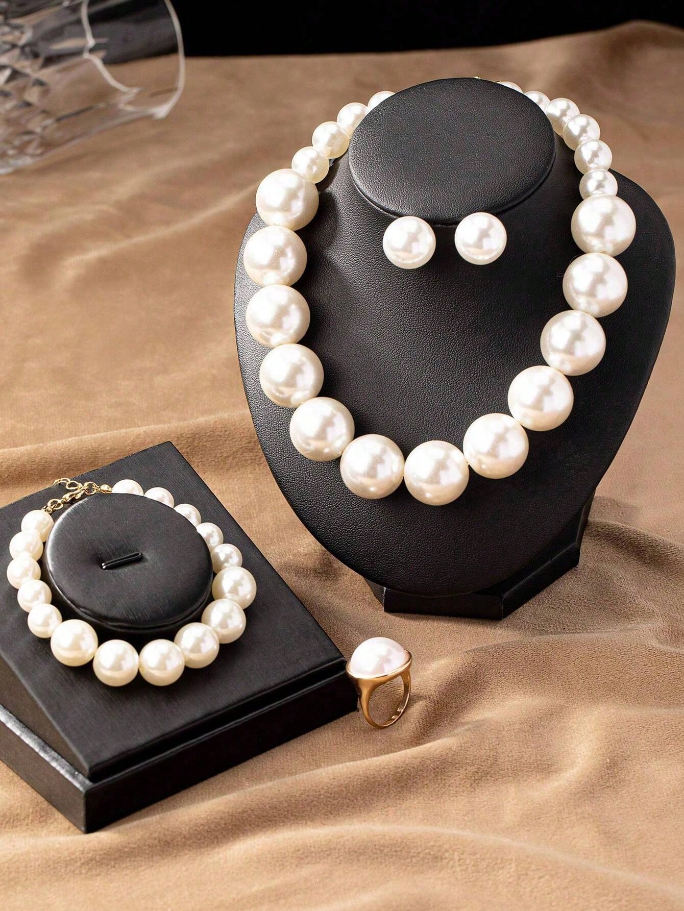 Exaggerated and trendy faux pearl earrings and faux pearl necklace