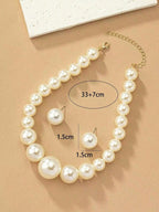 Exaggerated and trendy faux pearl earrings and faux pearl necklace