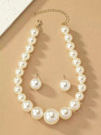 Exaggerated and trendy faux pearl earrings and faux pearl necklace