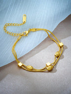Double layer woven studded chain bracelet in gold plated stainless steel with screw-in fastening